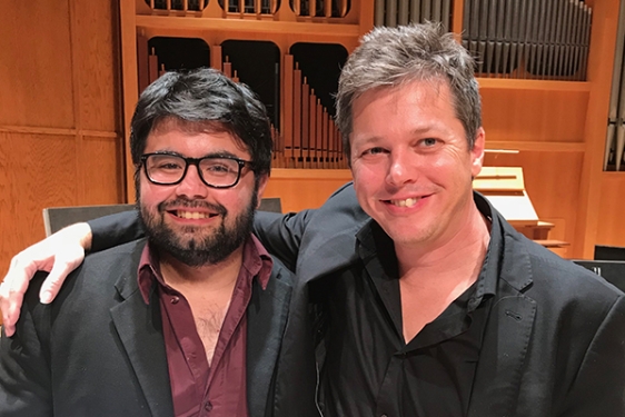 photo of two men in a concert hall